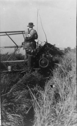 Man sits on a machine.