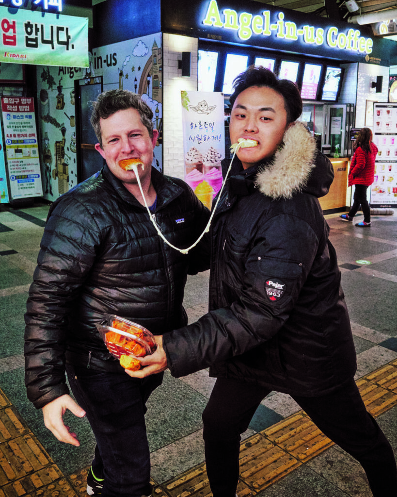 Matt Rodbard and Deuki Hong being food journalists in Korea. Courtesy of Koreaworld