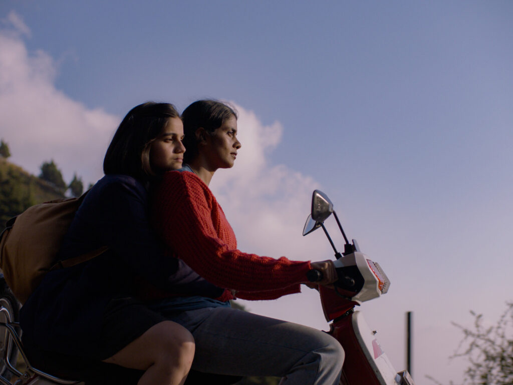 Still shot of characters Anila and Mira from Girls Will Be Girls, a CAAMFest 2024 centerpiece film about coming of age in a strict girls' boarding school in the Himalayas. Photo courtesy of CAAMFest