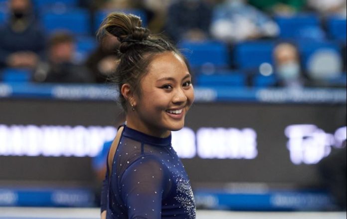 Gymnast Emma Malabuyo takes her bows after the floor exercise