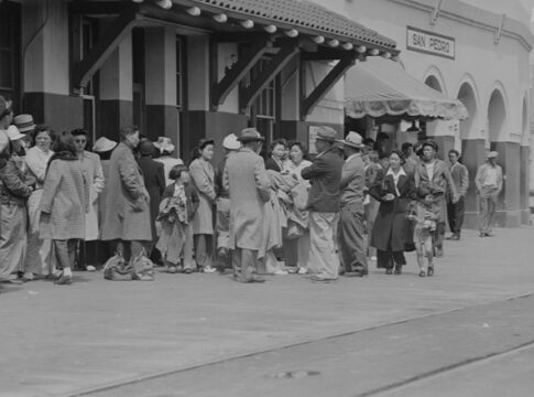 Japanese Americans on Terminal Island congregate on the street