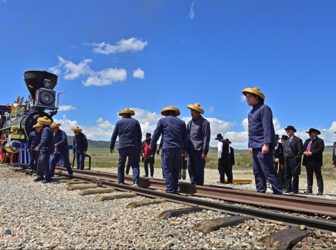 Chinese dressed as Chinese railroad workers join the celebration of the 155th anniversary of the building of the Transcontinental Railroad