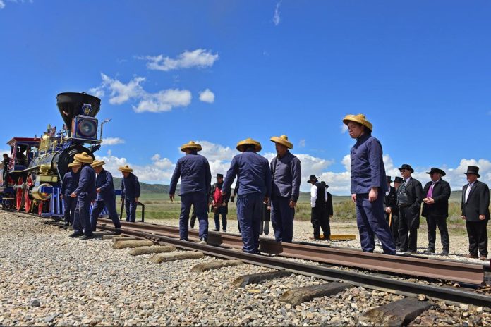 Chinese dressed as Chinese railroad workers join the celebration of the 155th anniversary of the building of the Transcontinental Railroad