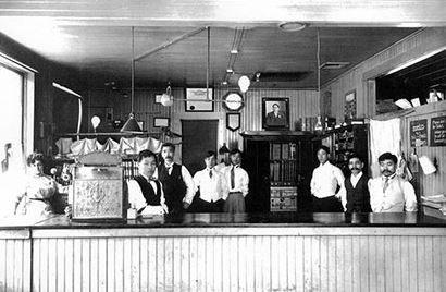 The photograph shows the Laundry's office staff along with founders K. Yabuki next
to the cash register and K. Okada, second from right. 
Courtesy: California Japantowns
