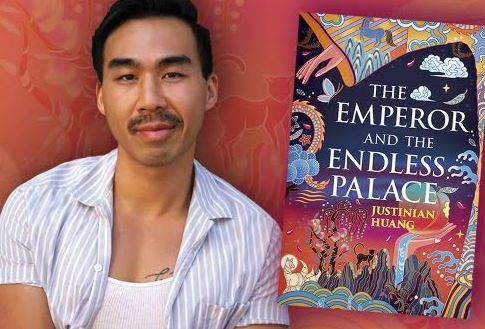 Author Justinian Huang poses next to the book cover of his book The Emperor and the Endless Palace