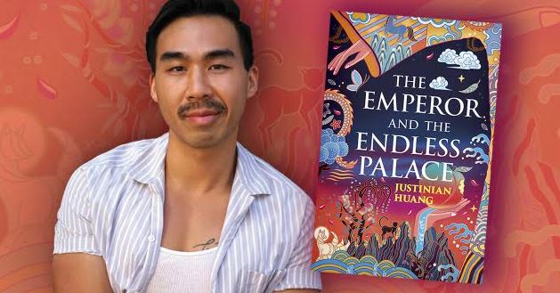 Author Justinian Huang poses next to the book cover of his book The Emperor and the Endless Palace