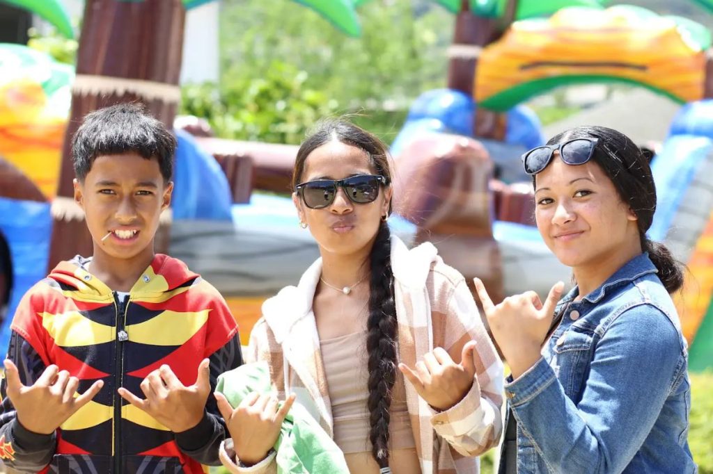 Lavana Marlik, center, said she volunteered at the event because she likes to support her culture and community. Micronesian people make up about 1% of Hawai’i’s population. 