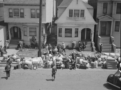 On the day of forced removal, Dorothea Lange captured this Oakland photo of Japanese Americans’ possessions waiting to be picked up by moving vans and transported to Tanforan Assembly Center to be claimed by their owners, May 1942.