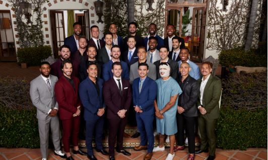 Contestants vying for Jenn Tran's love on the Bachelorette pose in front of the mansion