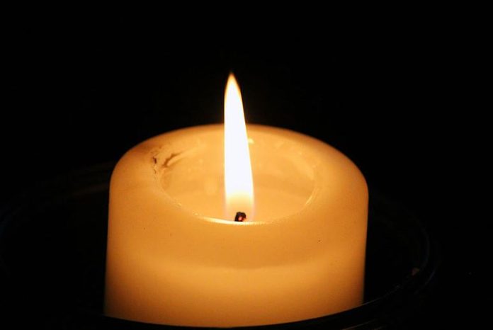 Candle flickers in the dark