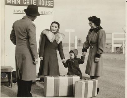 From the WRA: “Mrs. Saku Moriwaki, 33 (center), formerly of Berkeley, and her two year old
daughter, Suga Ann, are bid goodbye at the gate by a Caucasian staff member and her sister, Mrs. Suga
Baba. Mrs. Moriwaki has accepted a position in the home of Mrs. R. A. Isenberg (2175 Cowper Street),
Palo Alto. Her husband, Pfc. Yoshiaki Moriwaki, former Berkeley insurance broker, is fighting the Nazis.
Photographer: Mace, Charles E. Topaz, Utah.”
Courtesy: WRA Photo Collection, UC Berkeley, Bancroft Library