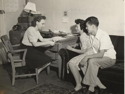 From the WRA: “Mr. and Mrs. George Yonekura are getting some leads on living and working
conditions in New York City from Miss Myrtle Barley, Counselor at the Brooklyn Hostel for Japanese
Americans. This handsome couple met at the Central Utah Relocation Center, where they were married
last spring. Mr. Yonekura is from Berkeley, California, and his wife is from Portland, Oregon. The
Brooklyn Hostel is operated on a non-sectarian basis by the Brethren Service Committee of the Church
of the Brethren. Brooklyn, New York.”
Courtesy: WRA Photo Collection, UC Berkeley, Bancroft Library