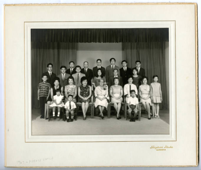 A group of family members posing for photo.