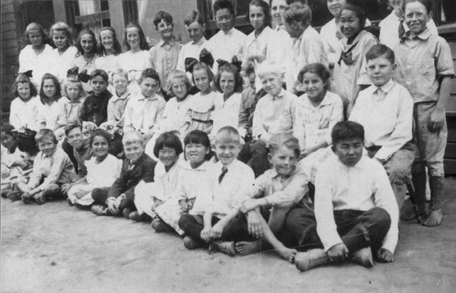 School children in three rows.