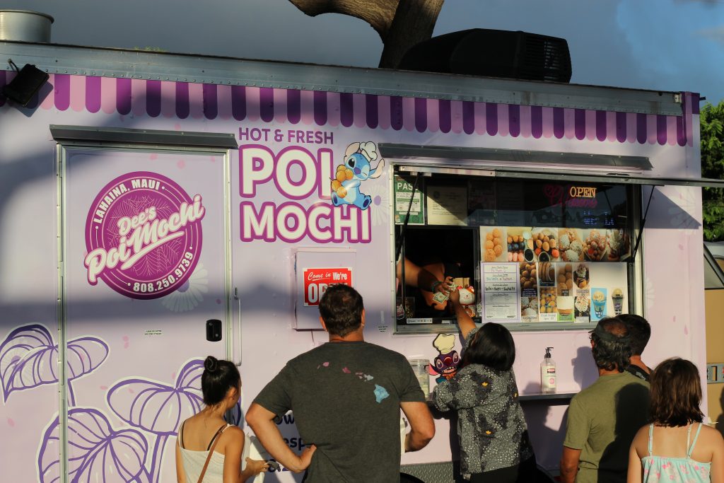 A purple food truck that says "Poi Mochi" and serves other delicacies like ice cream and fried oreos.