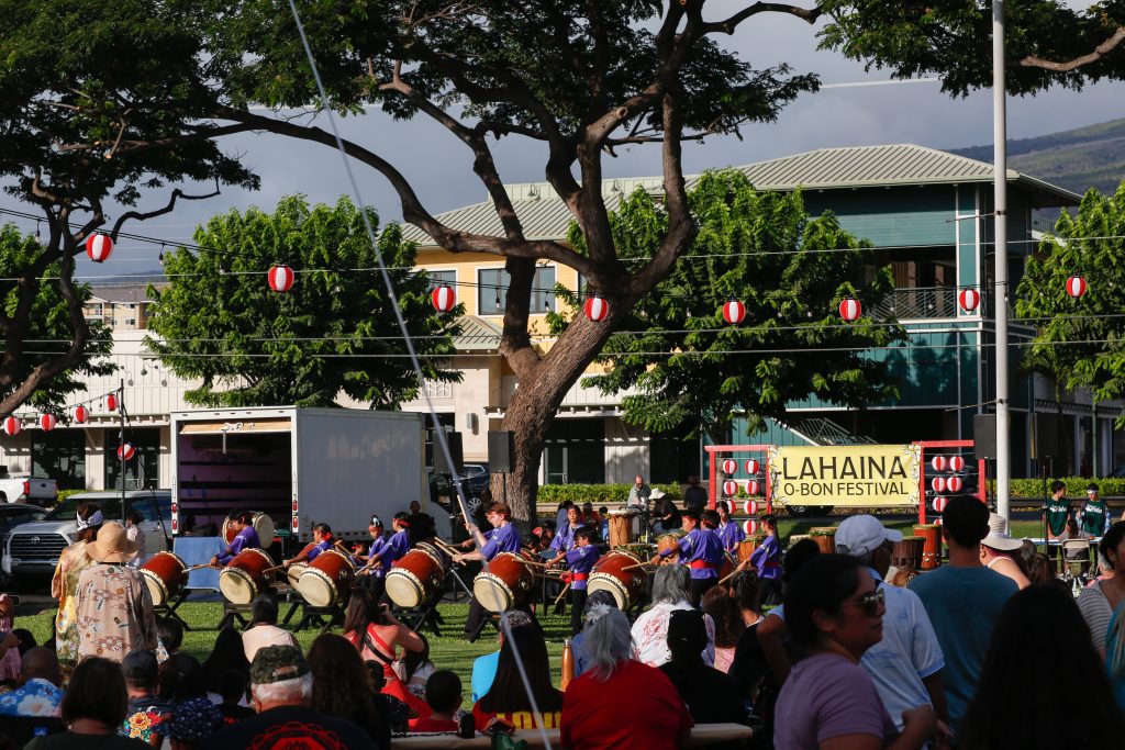 A kids taiko drum group performs.