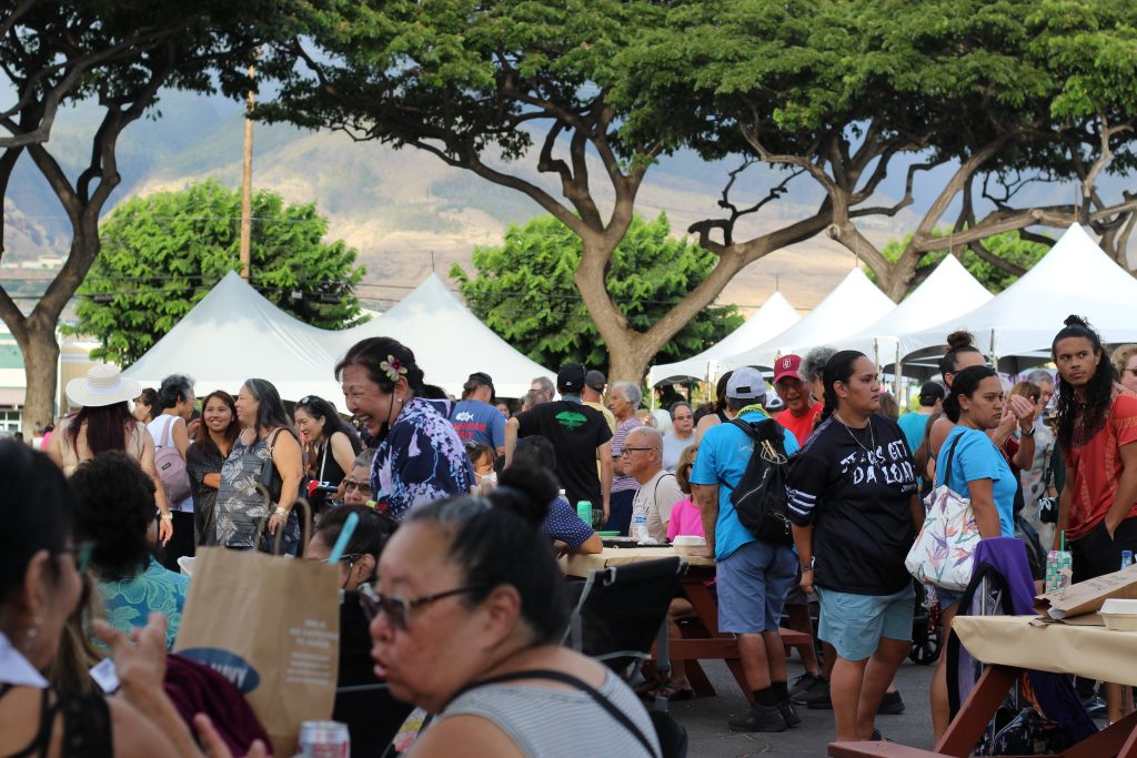 Hundreds of people come together in Lahaina's Cannery Mall to eat, talk and dance.