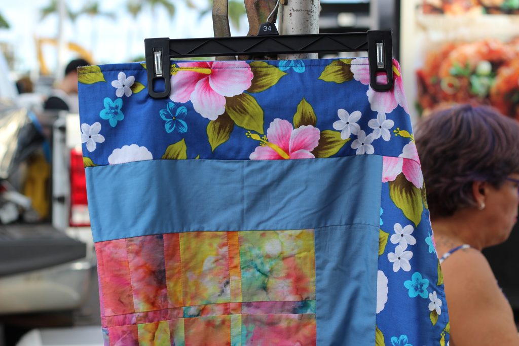 A blue multi-patterned quilt.