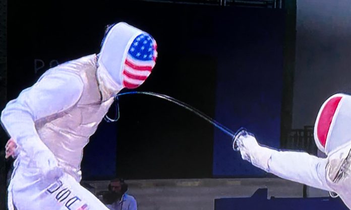 Taiwanese American Alex Massialas unsuccessfully takes on a French competitor in the team foil competition.