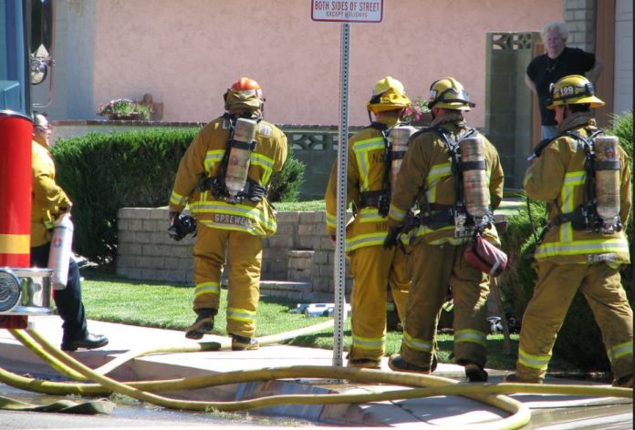 L A firefighters at the scene of a fire.