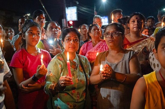 Doctors stage a candlelight protest following the rape and murder of a trainee doctor at RG Kar Hospital in India