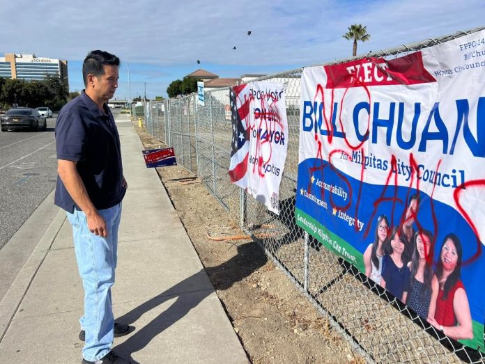 campaign signs defaced with racist grafitti