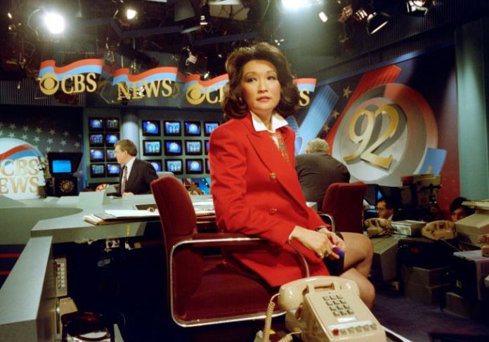 Connie Chung in the CBS News Studio with Dan Rather in the background