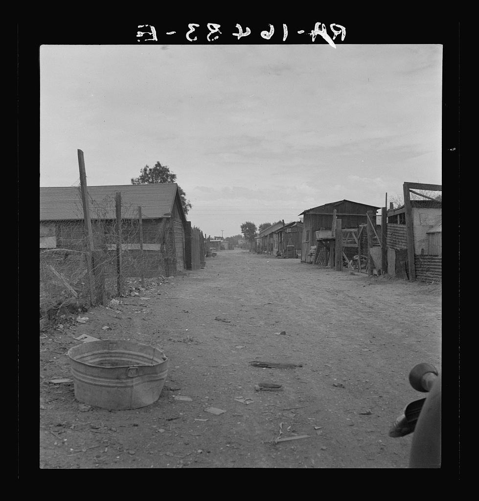 Houses on dirt street.