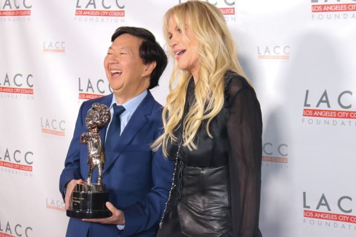 Ken Jeong with Joan Dangerfield, widow of Rodney Dangerfield, while holding the Rodney Respect Award