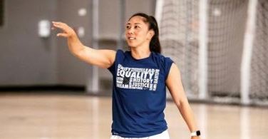 Coach Natalie Nakasec on the basketball court