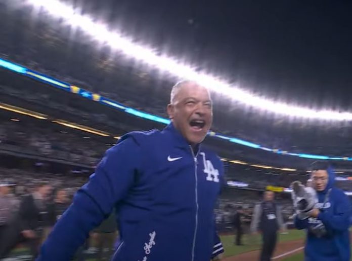 Dave Roberts rejoices after winning the World Series, his second as manager of the Dodgers