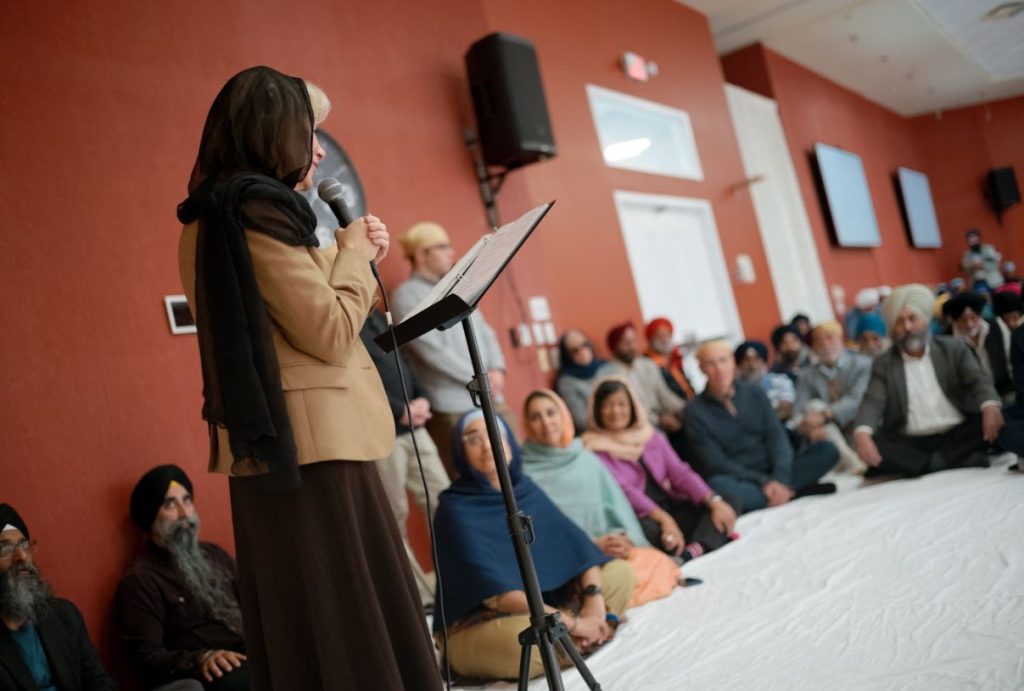 Gwen Walz, wife of VP candidate Tim Walz, visits with members of a Sikh temple in Plymouth, MI.