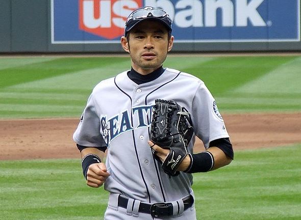 Ichiro Suzuki returns to the dugout after playing right field for the Seattle Mariners in 2011