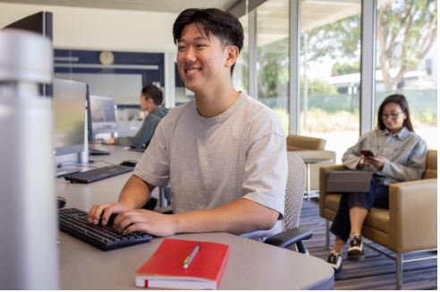 Student in front of a computer at a community college