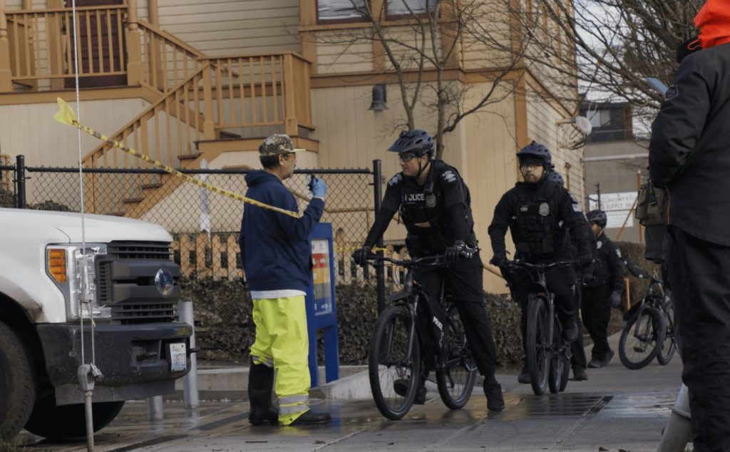 Officers on bikes patrol a high crime area in the Chinatown International district of Seattle.