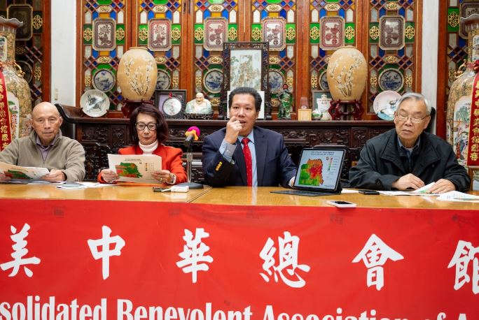 Henry Der, Lillian Sing, David Lee and Ding Lee behind a table at a news conference at the Chinese Six Companies