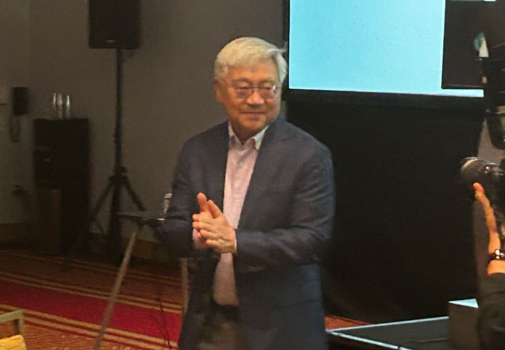 Stephen Gong soaks in the applause after he gave closing remarks at his retirement party. 