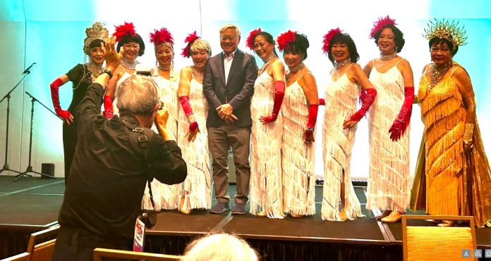 Stephen Gong poses with the Grant Avenue Follies after their performance at his retirement party