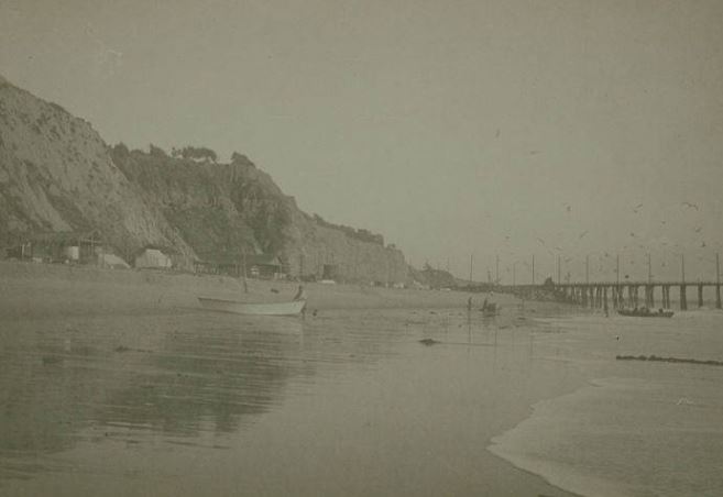 The beach with Japanese fishing village and Long Wharf in view, Santa Monica, Calif. in 1879, 