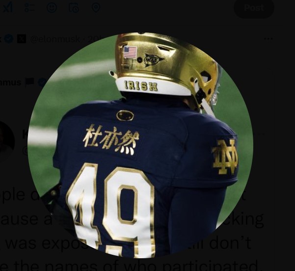 Notre Dame's Charles Du has his name on his football jersey emblazoned in Chinese characters