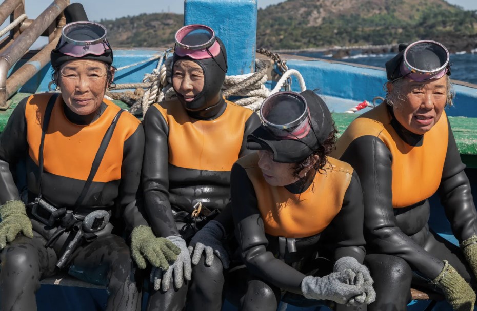 Four elderly women are seen in scuba diving outfits in Last of the Sea Women