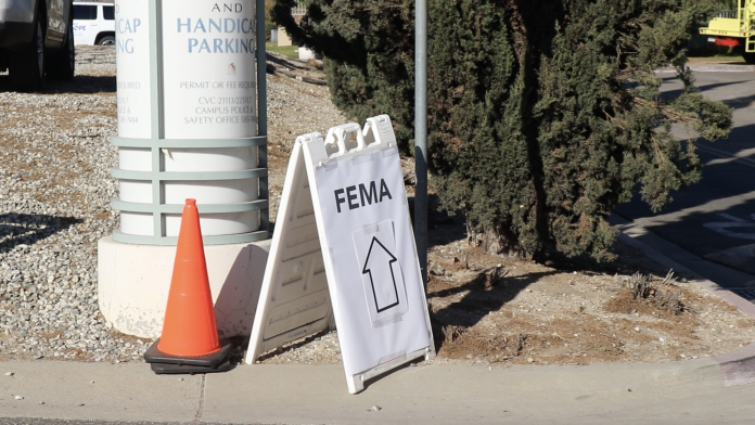 Sign directing visitors to FEMA assistance center