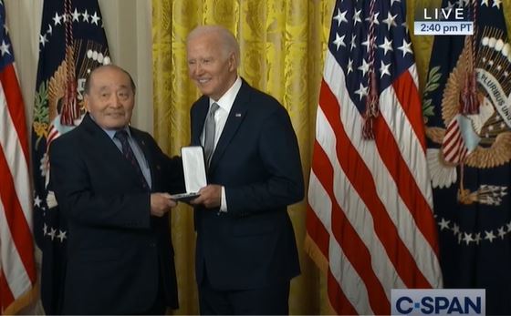 Wayne Tsutsumi accepts the Presidential Citizens Medal on behalf of his late mother, Mitsuye Endo Tsutsumi.