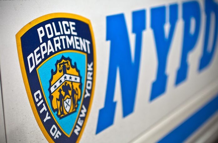 NYPD logo on side of police car