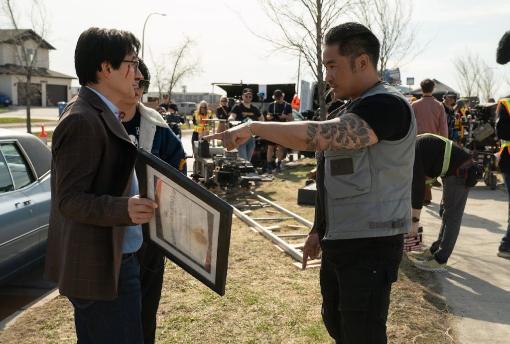 Ke Huy Quan and director Jonathan Eusebio on the set of Love Hurts. 