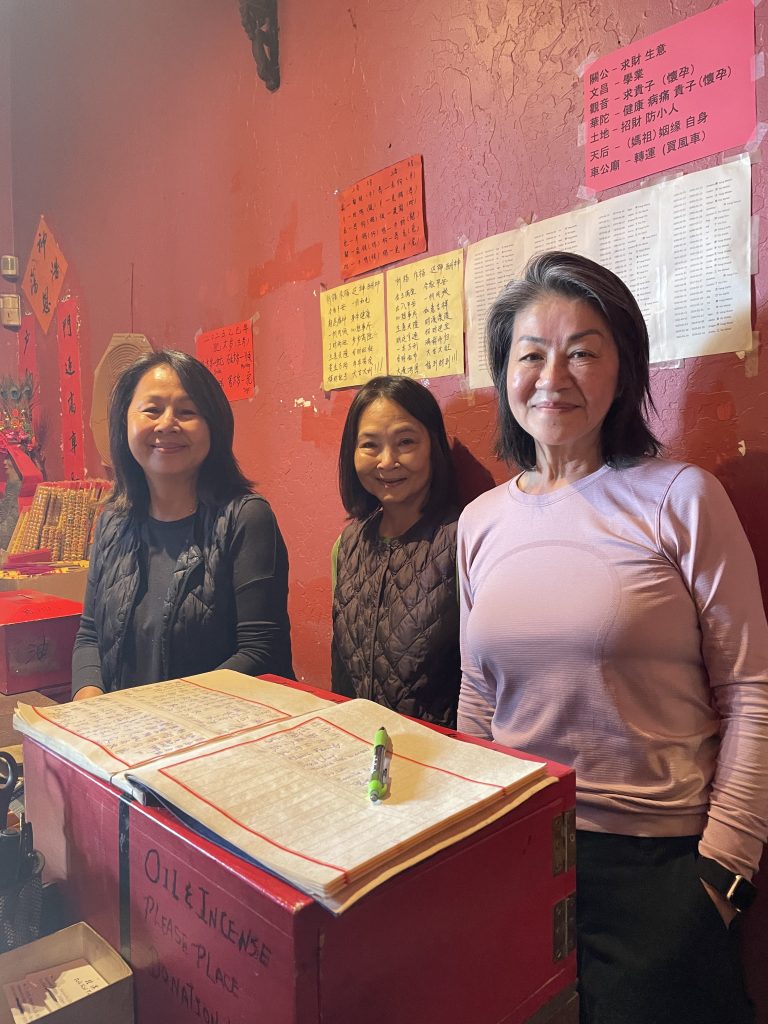 Photo taken by Frank Mah and Jeannie Young for AsAmNews. L to R - Three sisters, Jennifer Lau, Mable Vogt, and Helen Soon, who have been taking care of the Bok Kai Temple for 35 years, including driving from the Bay Area every weekend.