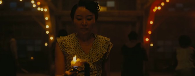 Li Jun Li is seen here holding a candle in Ryan Coogler's Sinners
