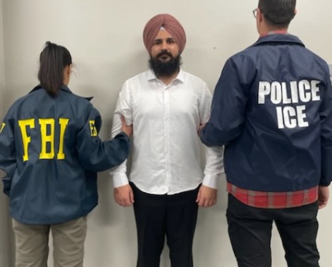 Harpreet Singh is seen here with an FBI and ICE agent