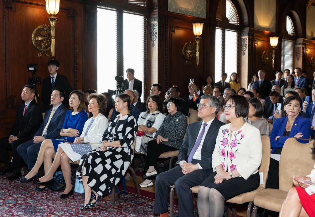 An overflow crowd looked on during the swearing in of the Commission of National Museum of Asian Pacific American History and Culture.